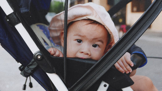 Close up of a baby in a stroller outdoors